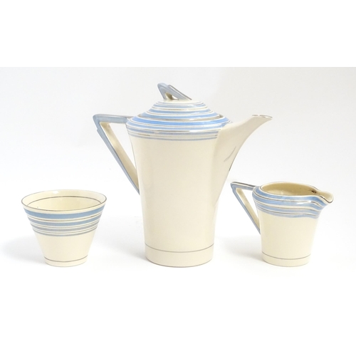 149 - An Art Deco Solian Ware coffee wares to include coffee pot, sugar bowl, milk jug, cups and saucers. ... 