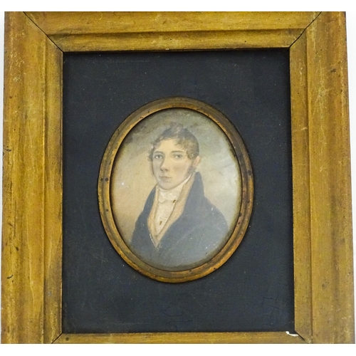 1212 - A 19thC watercolour on card portrait miniature depicting a young man wearing a blue jacket. Indistin... 