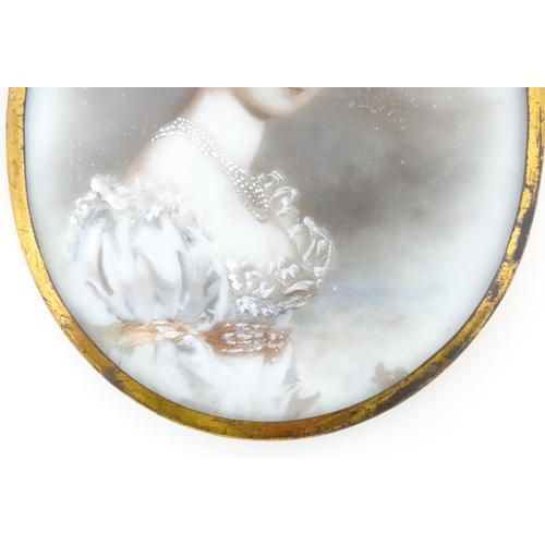 1219 - An early 20thC photograph frame with floral micro mosaic surround. Together with an oval porcelain p... 