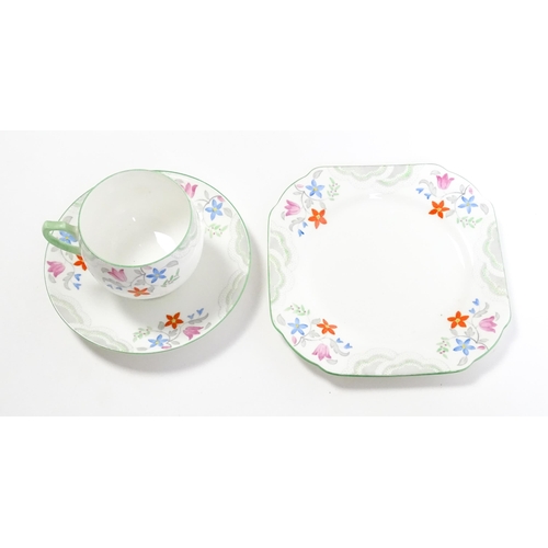 197 - A quantity of Shelley tea wares decorated with flowers to include cups, saucers, plates, cake / sand... 