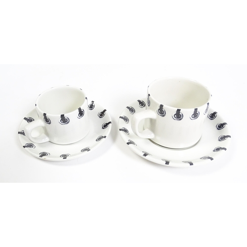 220 - A quantity of Dr Martens Air Wair dinner and tea wares with eyelet detail to include plates, bowls, ... 