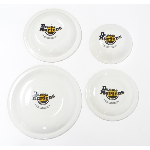 220 - A quantity of Dr Martens Air Wair dinner and tea wares with eyelet detail to include plates, bowls, ... 