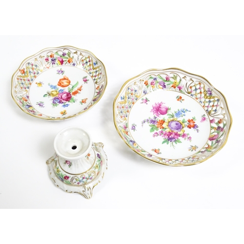 91 - A German part dessert service with pierced borders and floral decoration, to include plates, basket,... 