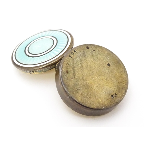 306 - A Continental silver gilt pill / patch box with guilloche enamel detail to lid. Indistinctly marked,... 