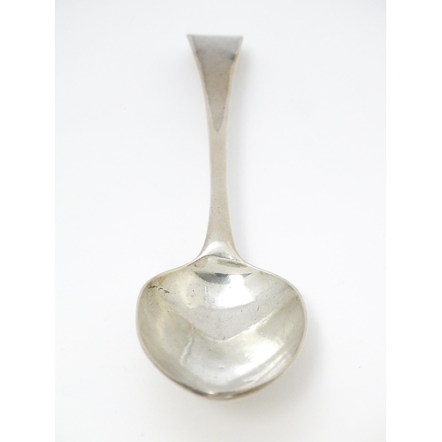 527 - A Geo III silver table spoon hallmarked London 1780, maker WC. Approx. 8 1/2