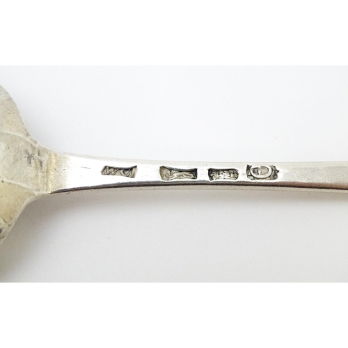 527 - A Geo III silver table spoon hallmarked London 1780, maker WC. Approx. 8 1/2