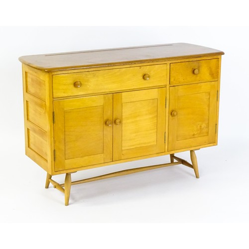 1630 - Vintage / Retro: An Ercol elm sideboard, model 351. The figured elm top above a single long drawer, ... 