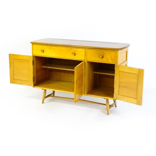 1630 - Vintage / Retro: An Ercol elm sideboard, model 351. The figured elm top above a single long drawer, ... 