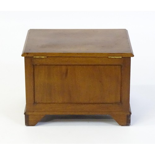 1502 - An early / mid 20thC mahogany log bin / coal box with a hinged lid, metal lined interior and raised ... 