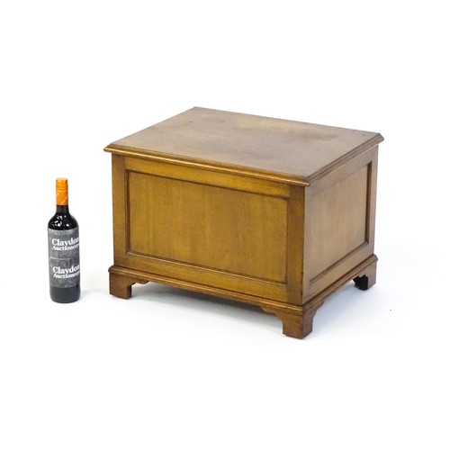 1502 - An early / mid 20thC mahogany log bin / coal box with a hinged lid, metal lined interior and raised ... 