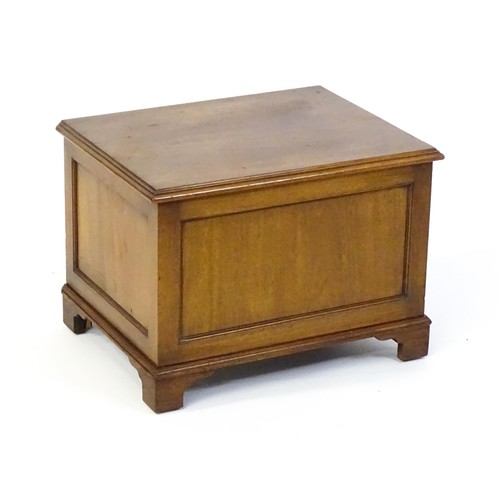 1502 - An early / mid 20thC mahogany log bin / coal box with a hinged lid, metal lined interior and raised ... 