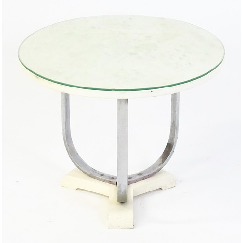 1635 - Mid Century / Modern - A coffee table with a circular top raised on three chromed supports and a tri... 