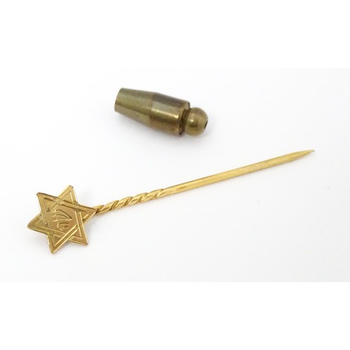 679 - Judaica Interest: A yellow metal stick pin surmounted by Star of David. Approx 1 3/4