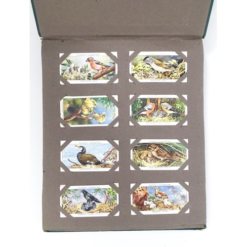 1944 - A quantity of cigarette cards in albums and loose, series to include Players: Birds & Their Young, A... 