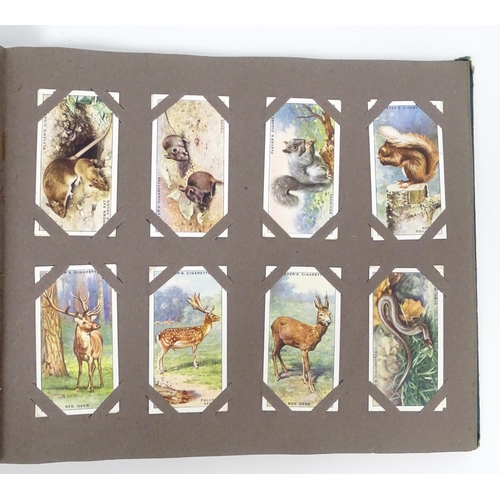 1944 - A quantity of cigarette cards in albums and loose, series to include Players: Birds & Their Young, A... 