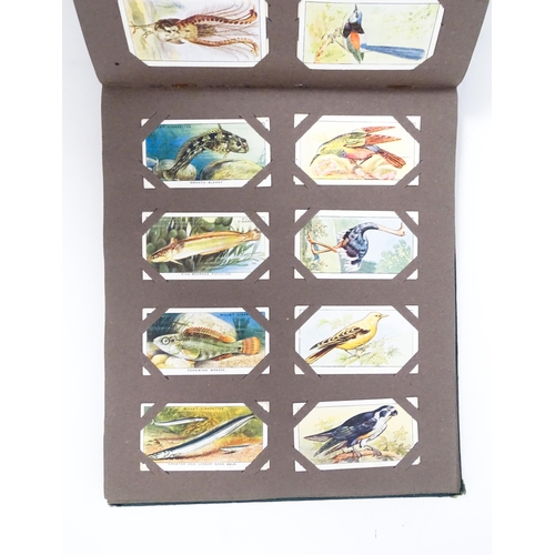 1944 - A quantity of cigarette cards in albums and loose, series to include Players: Birds & Their Young, A... 