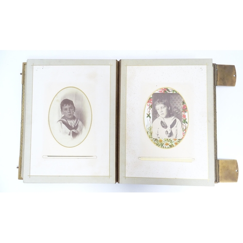 1952 - Two Victorian leather bound photograph / carte de visite albums with shaped mounts. Largest approx. ... 