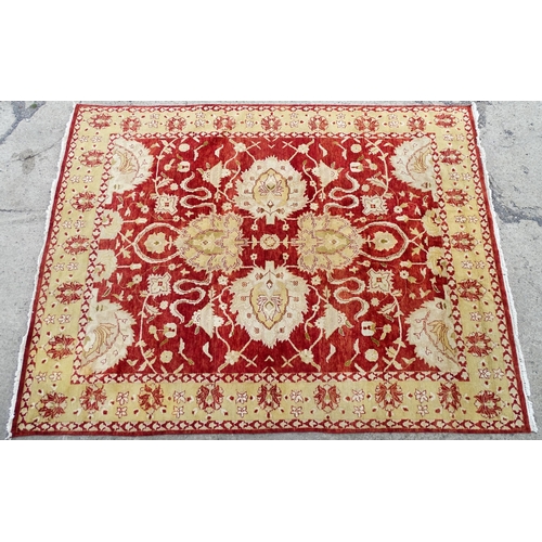 1335 - Carpet / Rug : A red ground rug with cream beige borders and floral and foliate detail. ' Palazzo Qu... 