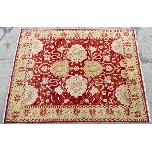 1335 - Carpet / Rug : A red ground rug with cream beige borders and floral and foliate detail. ' Palazzo Qu... 