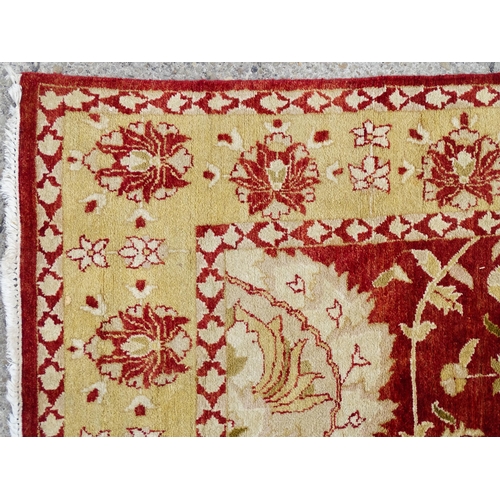 1335 - Carpet / Rug : A red ground rug with cream beige borders and floral and foliate detail. ' Palazzo Qu... 