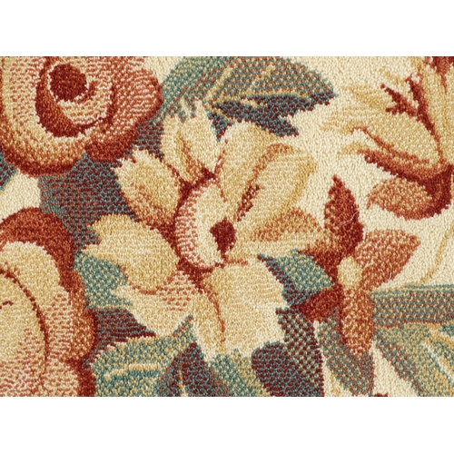 1336 - Carpet / Rug : A red ground rug with central floral vignette and garland with foliate detail with cr... 