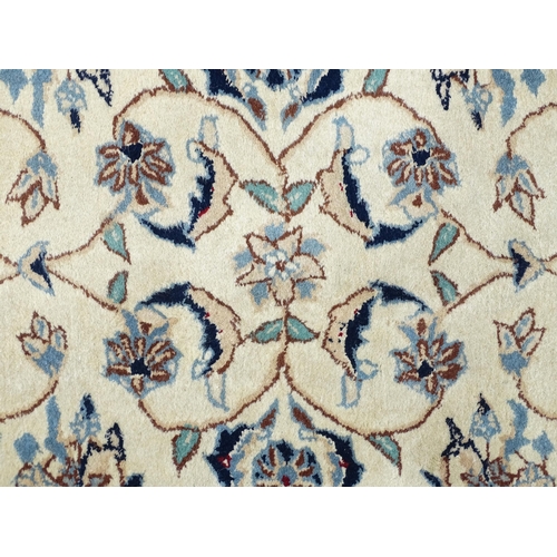 1338 - Carpet / Rug : A beige ground runner with floral and foliate detail worked in shades of blue.  Appro... 