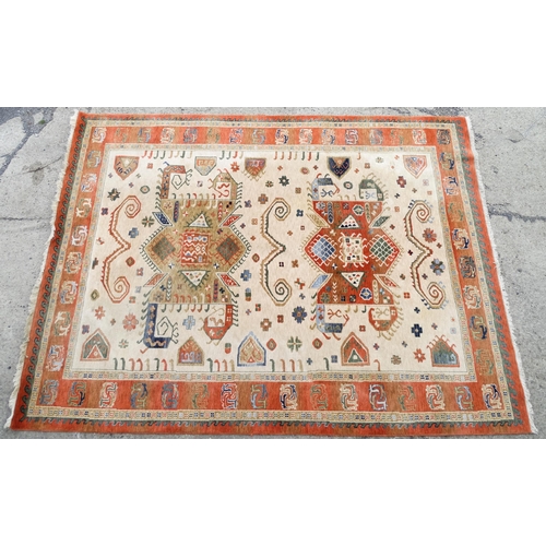 1341 - Carpet / Rug : A cream ground rug with dark salmon / terracotta borders, decorated with geometric an... 