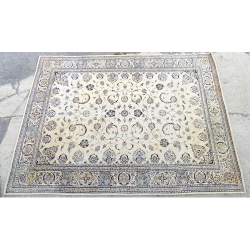 1342 - Carpet / Rug : A beige ground rug with floral and foliate detail worked in shades of blue.  Approx. ... 