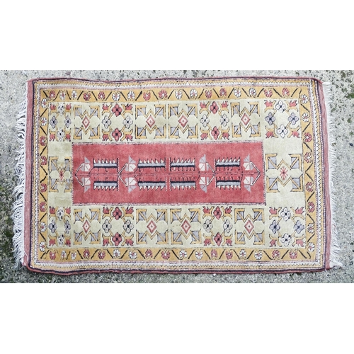 1345 - Carpet / Rug : A rug with salmon and cream grounds with geometric and floral detail and mustard bord... 