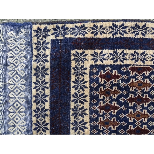 1346 - Carpet / Rug : A blue ground runner with repeating geometric motifs and cream ground borders  Approx... 