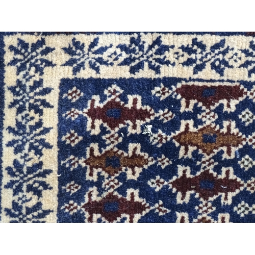 1346 - Carpet / Rug : A blue ground runner with repeating geometric motifs and cream ground borders  Approx... 