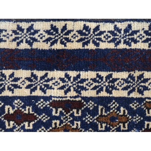 1346 - Carpet / Rug : A blue ground runner with repeating geometric motifs and cream ground borders  Approx... 