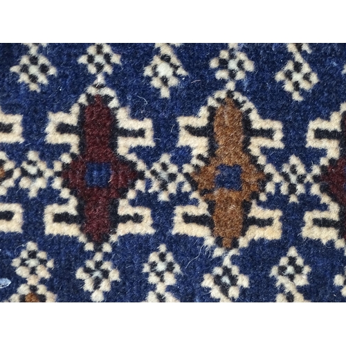 1346 - Carpet / Rug : A blue ground runner with repeating geometric motifs and cream ground borders  Approx... 