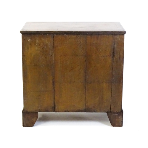 1450 - An 18thC walnut chest of drawers with a moulded and crossbanded top above two short over three long ... 