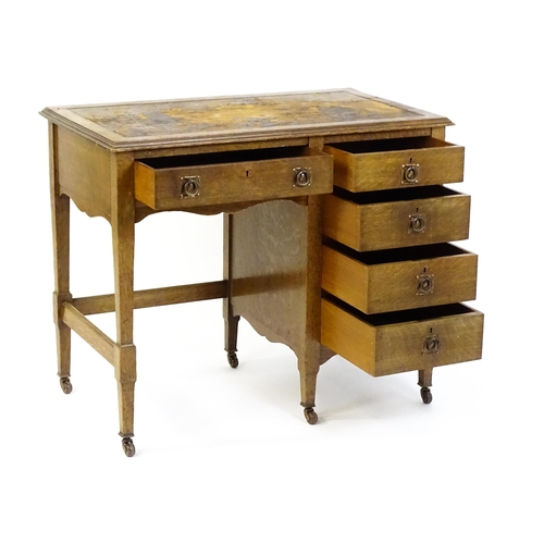 1478 - An Arts & Crafts oak desk, with an inset leather top above a bank of four graduated drawers and one ... 