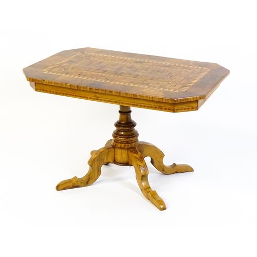 1544 - A late 20thC walnut table with Sorrento style satinwood marquetry decoration, the table top above a ... 