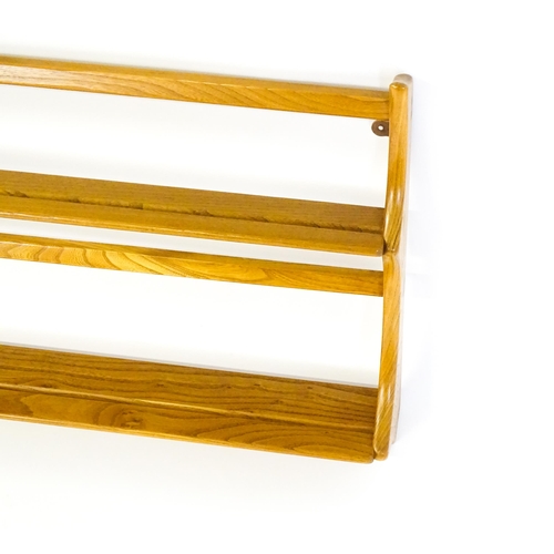 1634 - Vintage / Retro: An elm Ercol two tier plate rack. 38 wide x 20