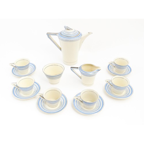 149 - An Art Deco Solian Ware coffee wares to include coffee pot, sugar bowl, milk jug, cups and saucers. ... 