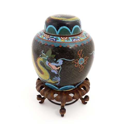 1057 - A Chinese cloisonne ginger jar with a black ground decorated with dragons and a flaming pearl. Toget... 