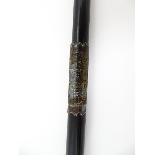 1118 - An early 20thC ebonised conductor's baton of tapering form with silver mounts engraved with foliate ... 