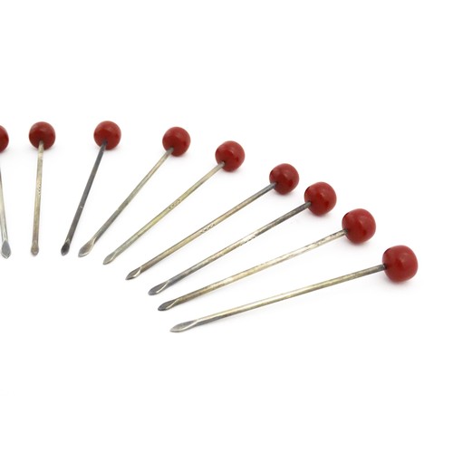 1138 - Eleven 20thC silver plate cocktail sticks with red cherry formed finials. Approx. 3 1/4