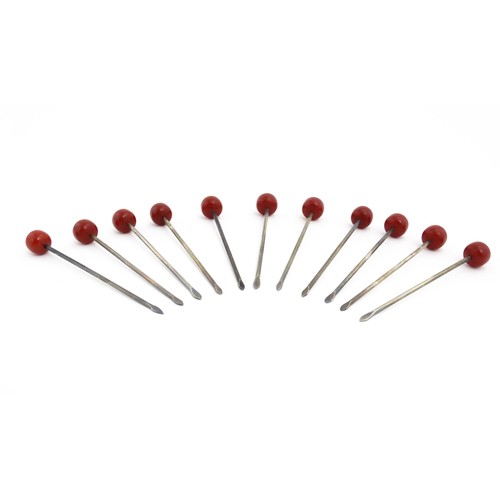 1138 - Eleven 20thC silver plate cocktail sticks with red cherry formed finials. Approx. 3 1/4