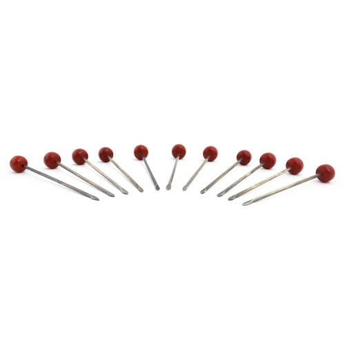 1138 - Eleven 20thC silver plate cocktail sticks with red cherry formed finials. Approx. 3 1/4