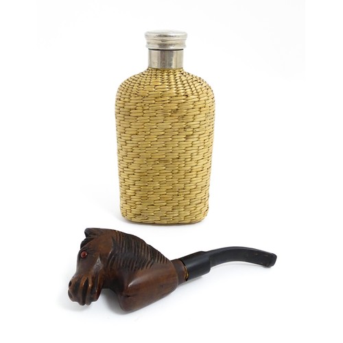 1176 - An early 20thC hip flask with rattan woven cover. Together with a carved novelty tobacco pipe, the b... 