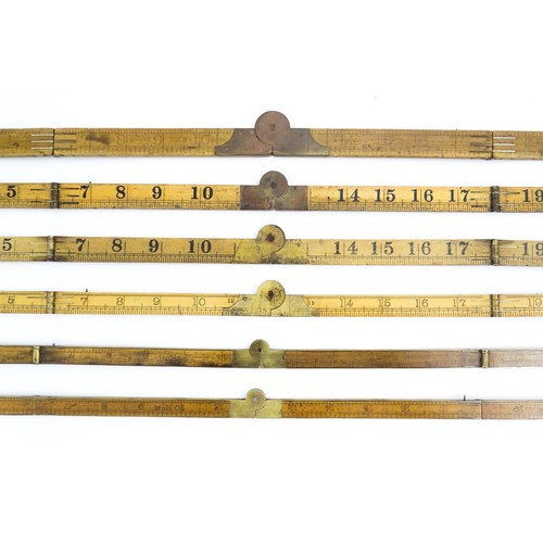 1202 - A quantity of 20thC boxwood and brass folding rulers to include examples by Rabone, Stanley Rule & L... 