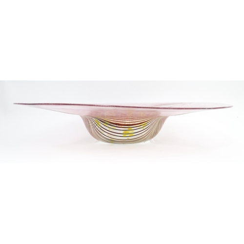 227 - A George Elliott of Bewdley (1933-1988) art glass dish with linear detail on a mottled pink ground. ... 