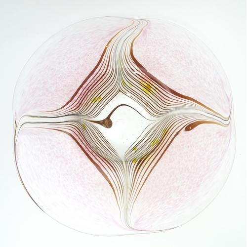 227 - A George Elliott of Bewdley (1933-1988) art glass dish with linear detail on a mottled pink ground. ... 