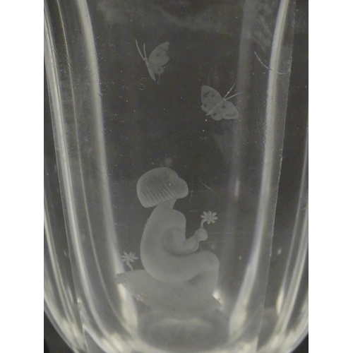 228 - Scandinavian art glass: An Orrefors glass vase with etched girl and butterfly detail. Signed under. ... 