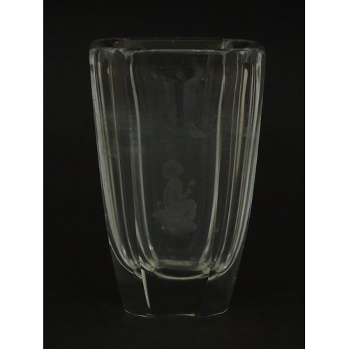 228 - Scandinavian art glass: An Orrefors glass vase with etched girl and butterfly detail. Signed under. ... 