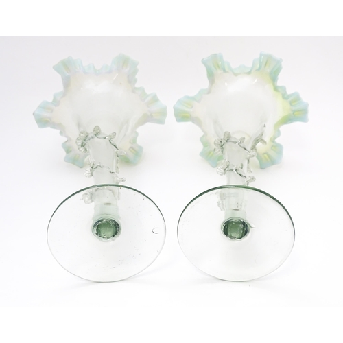 230 - A pair of art glass vases with flared rims and prunt detail. Approx. 10 1/4